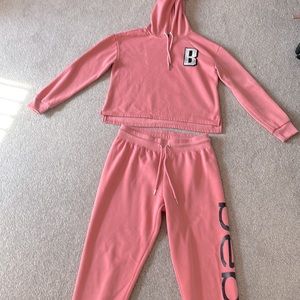 Womens sweatsuit. Bebe. Medium top, large bottom.